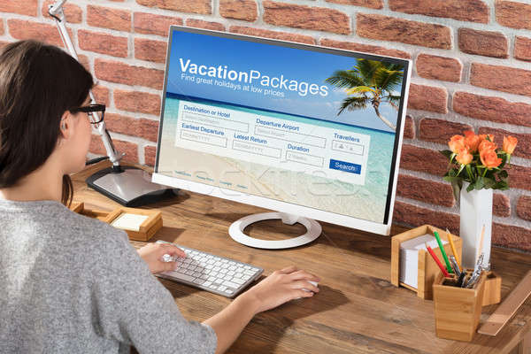 Woman Filling The Vacations Packages Form Stock photo © AndreyPopov
