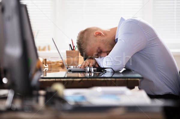 Businessman Sleeping Over The Desk Stock photo © AndreyPopov