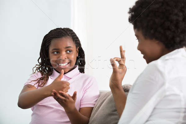 глухой матери говорить язык жестов дочь улыбаясь Сток-фото © AndreyPopov