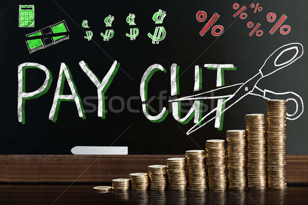 Salário bloco de notas atrás moedas dinheiro Foto stock © AndreyPopov