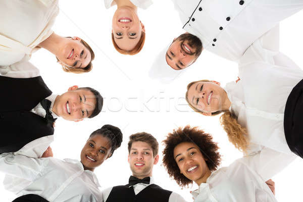 Happy Restaurant Staff Forming Huddle Stock photo © AndreyPopov