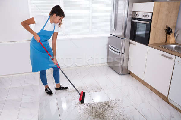 Housemaid Cleaning Floor With Broom Stock photo © AndreyPopov