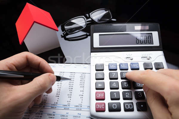 Businessperson Calculating Financial Report Stock photo © AndreyPopov
