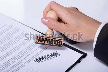 Businessperson Stamping On Approved Contract Form Stock photo © AndreyPopov