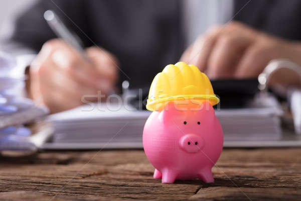 Close-up Of Piggybank With Hard Hat Stock photo © AndreyPopov