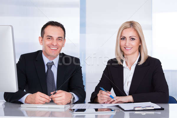 Stock photo: Happy Business Colleagues At Office Working Together
