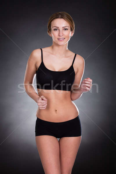 Fiatal nő jogging portré színes lány kéz Stock fotó © AndreyPopov