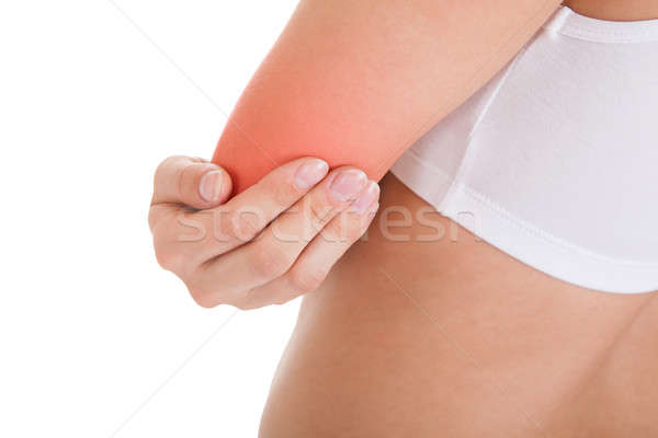 Kobieta łokieć ból odizolowany biały Zdjęcia stock © AndreyPopov