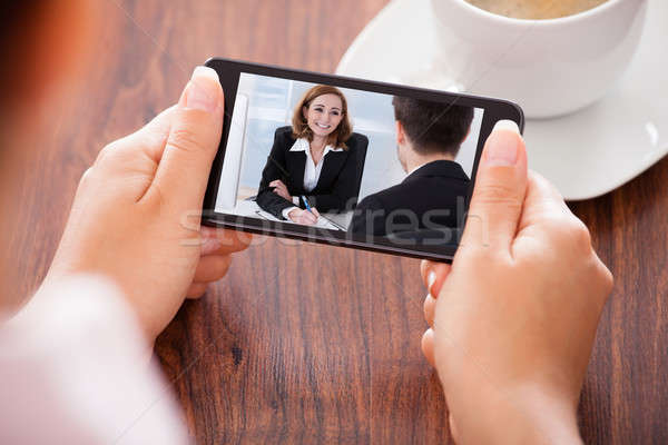 Woman Video Conferencing On Mobile Phone Stock photo © AndreyPopov