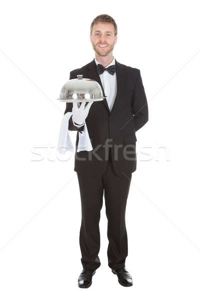Portrait Of Confident Waiter Holding Domed Tray Stock photo © AndreyPopov