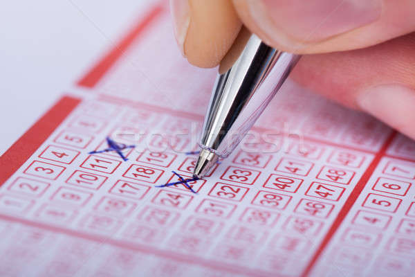 Pessoa número loteria bilhete caneta Foto stock © AndreyPopov