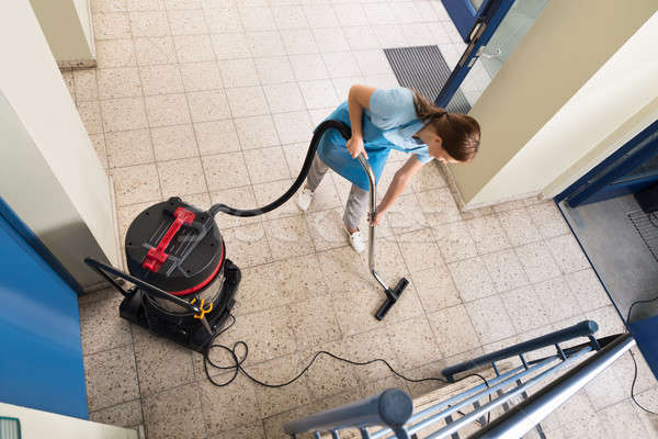 Janitor Vacuuming Floor Stock photo © AndreyPopov