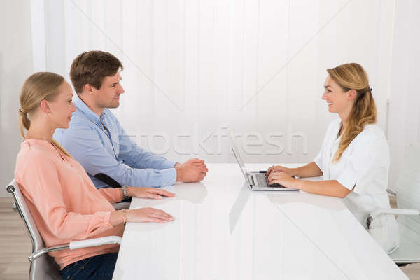 Doctor Talking With Young Couple Stock photo © AndreyPopov