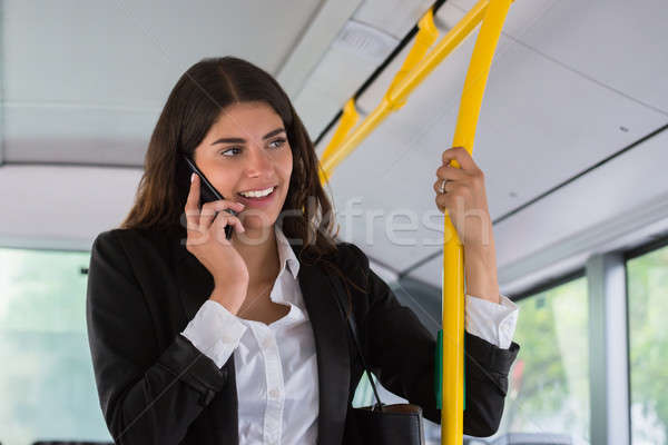 Stockfoto: Gelukkig · zakenvrouw · praten · smartphone · jonge