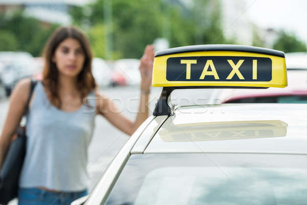 Woman Calling For Taxi On Street Stock photo © AndreyPopov
