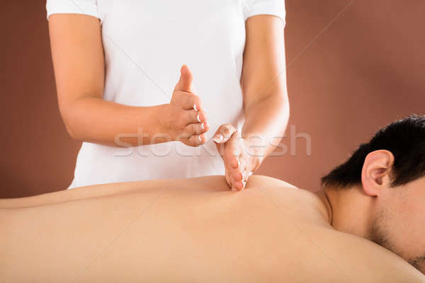 Człowiek powrót masażu terapeuta spa Zdjęcia stock © AndreyPopov