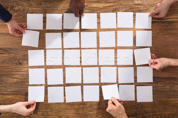 People Hands Arranging White Papers Stock photo © AndreyPopov