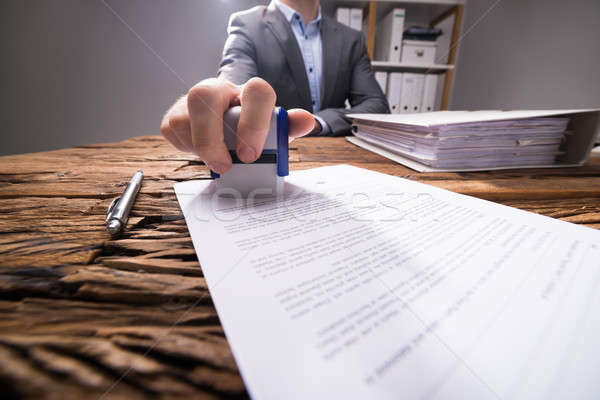 Close-up Of A Businessperson Approving Document Stock photo © AndreyPopov