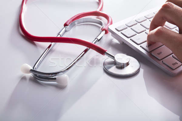 Doctor's Hand Typing On Keyboard Stock photo © AndreyPopov
