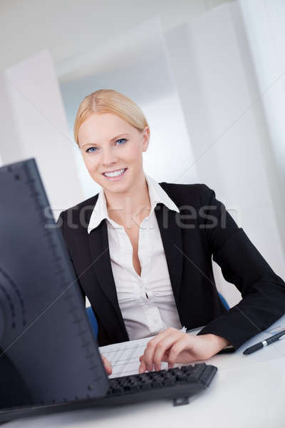 Successful young businesswoman working Stock photo © AndreyPopov
