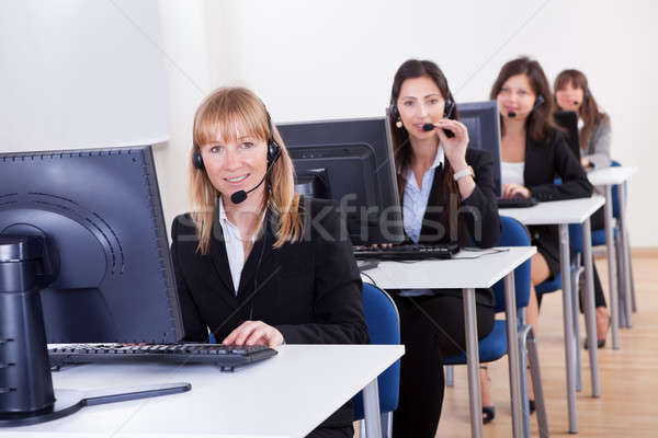 Call center csetepaté vonzó fiatal ülő számítógépek Stock fotó © AndreyPopov