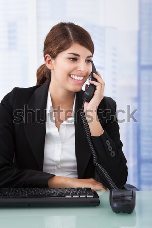 Smiling receptionist or call centre worker Stock photo © AndreyPopov