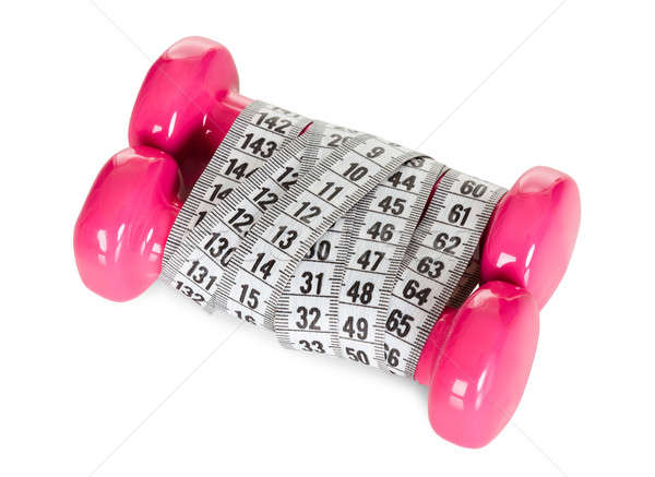 Dumbbells wrapped in measuring tape Stock photo © AndreyPopov