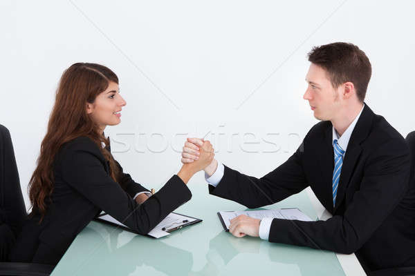 Business People Arm Wrestling On Desk In Office Stock photo © AndreyPopov