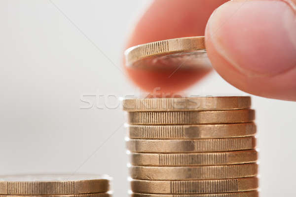 Businessman Hand Stacking Coins In Office Stock photo © AndreyPopov