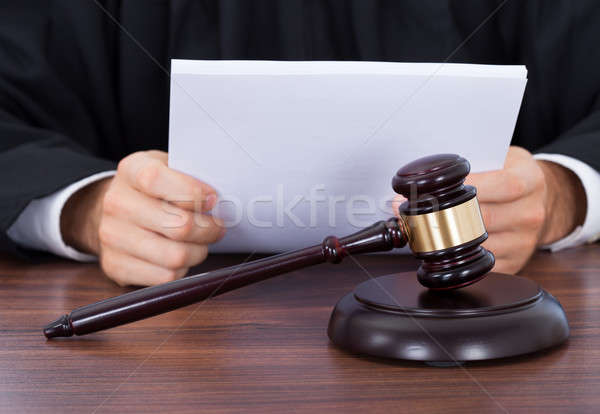 Judge Reading Documents At Desk Stock photo © AndreyPopov