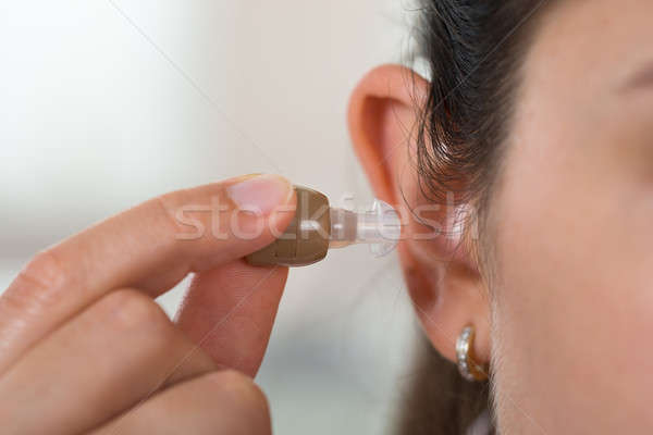 Női kéz hallókészülék közelkép fül nő Stock fotó © AndreyPopov