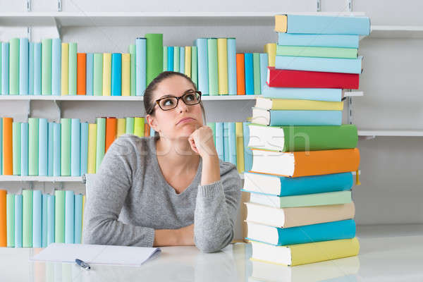 Stock photo: Contemplating Woman Sitting At Desk