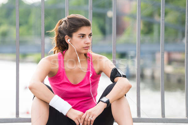 Contemplated Fitness Woman Listening To Music Stock photo © AndreyPopov