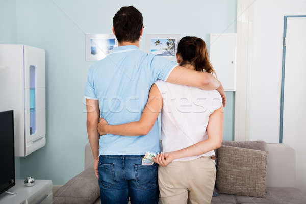 Woman Stealing Money From Husband's Pocket Stock photo © AndreyPopov