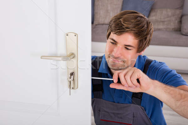 Handwerker neue Tür Schraubendreher home glücklich Stock foto © AndreyPopov