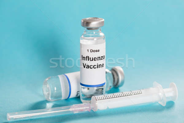Imagine de stoc: Gripa · gripa · vaccin · seringă · turcoaz · sticlă
