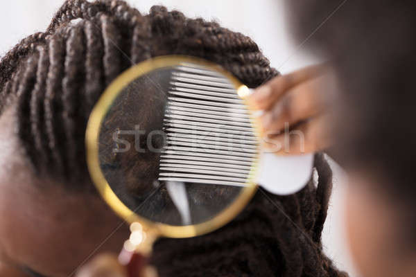 Dermatologo guardando capelli primo piano lente di ingrandimento donna Foto d'archivio © AndreyPopov