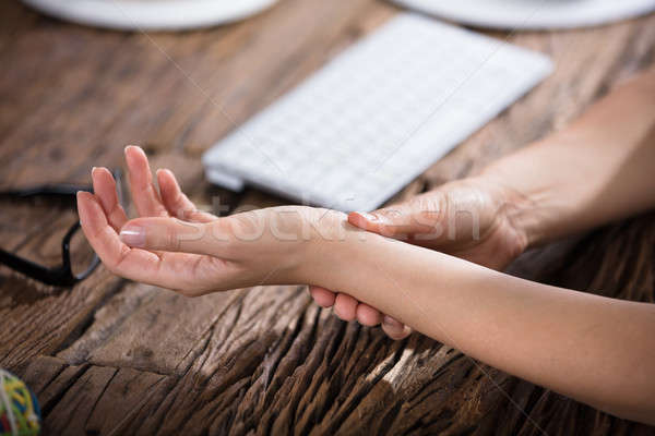 Businessperson Holding Painful Wrist Stock photo © AndreyPopov