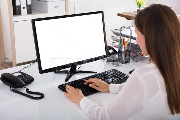 Businesswoman Working On Computer Stock photo © AndreyPopov