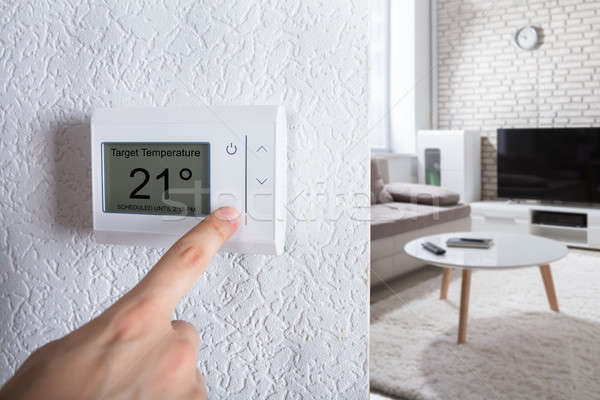 Személyek kéz digitális termosztát közelkép otthon Stock fotó © AndreyPopov