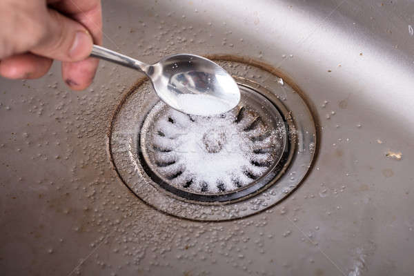 Pessoa limpeza drenar soda água Foto stock © AndreyPopov