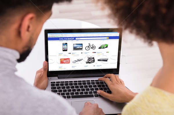 Couple Using Laptop For Shopping Online Stock photo © AndreyPopov