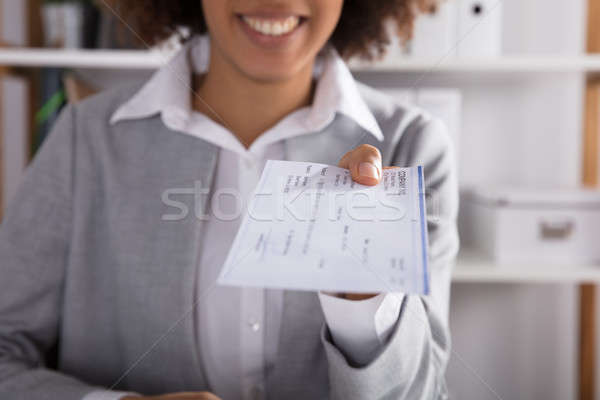 Businessperson Giving Cheque In Office Stock photo © AndreyPopov