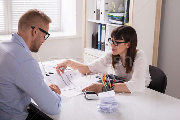 Financial Advisor Discussing Invoice With Her Client Stock photo © AndreyPopov