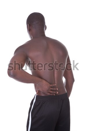 Om dureri de spate bustul gol african tânăr Imagine de stoc © AndreyPopov
