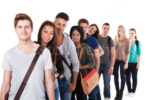 Confident College Students Standing In A Queue Stock photo © AndreyPopov