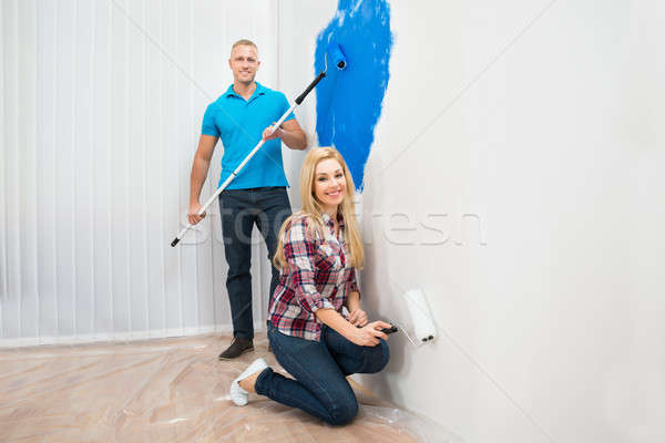 Young Couple Panting Wall Stock photo © AndreyPopov