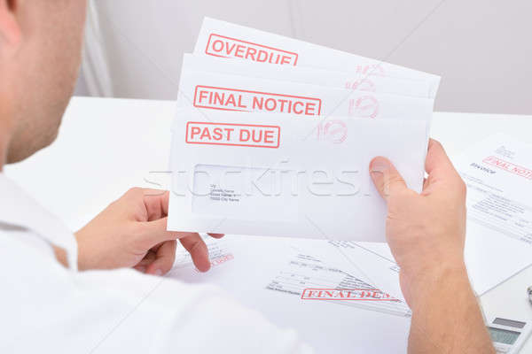 Stock photo: Man Looking At Legal Notices