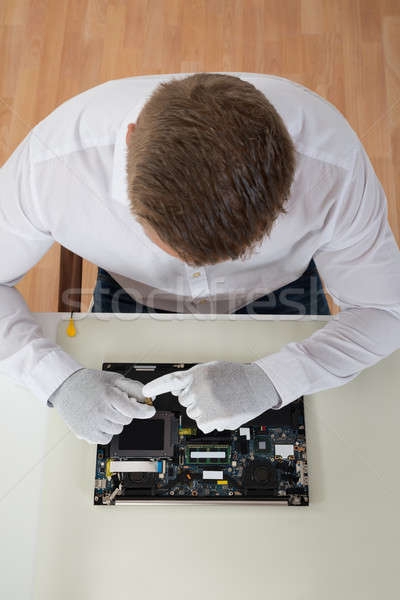 Man Repairing Laptop Motherboard Stock photo © AndreyPopov
