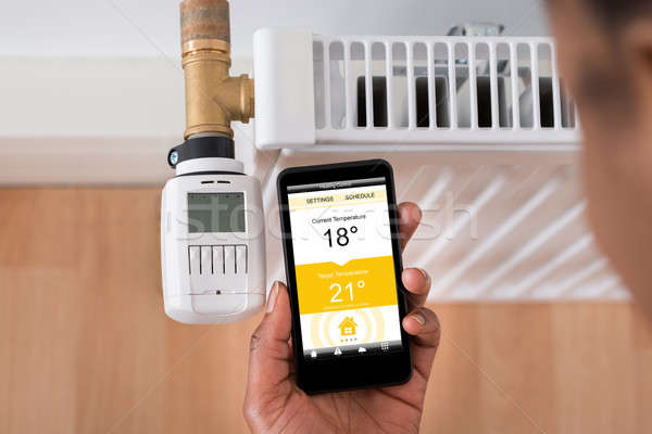 Température thermostat personnes main Photo stock © AndreyPopov